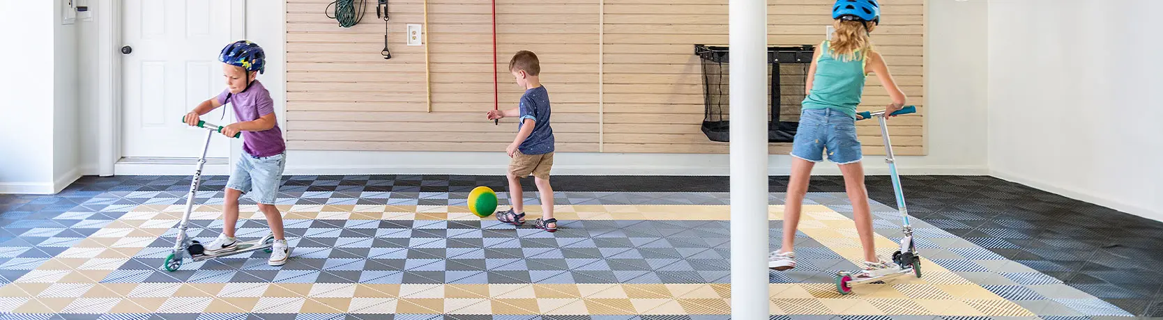 Interlocking garage floor tiles in a patterned layout