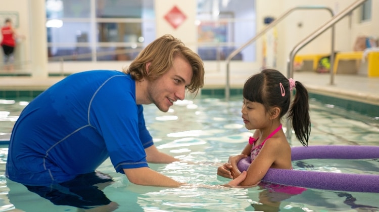 a man and a girl in a pool