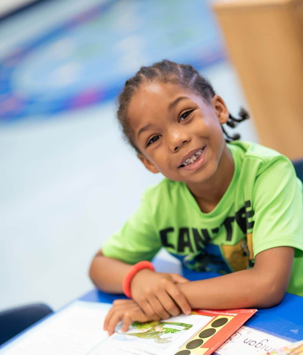 a girl smiling at the camera