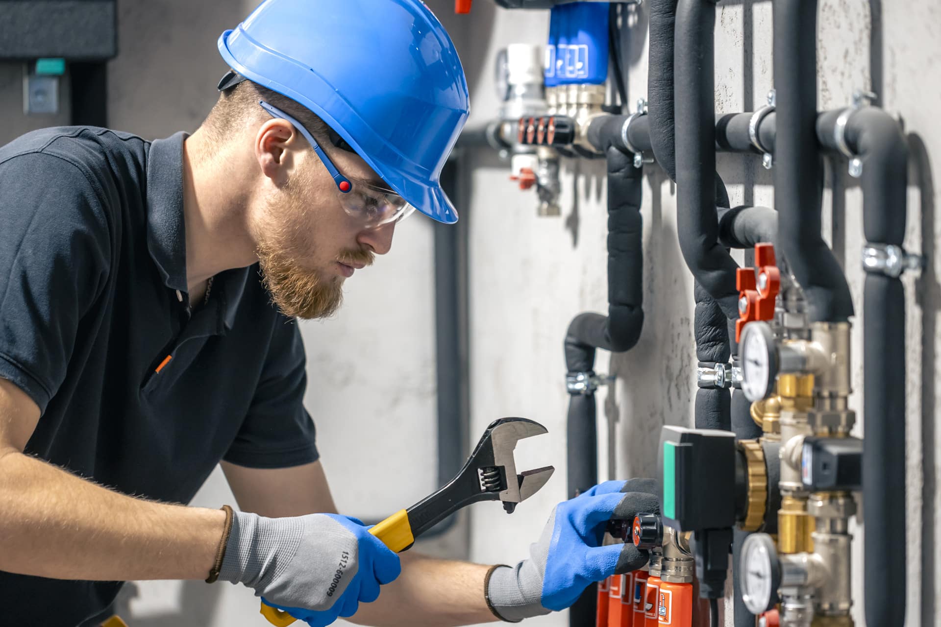 Technician working on pipes